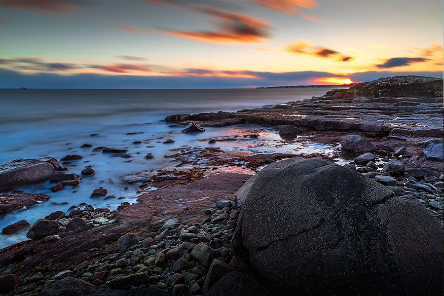 Clinton CT Insurance - Rocky Beach in Conneticut Overlooking a Beautiful Sunset